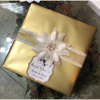 Wrapping with Confetti flower and tag Flower and tag