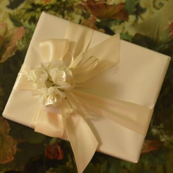 Gift Wrapping with bow, ribbons, flowers and confetti