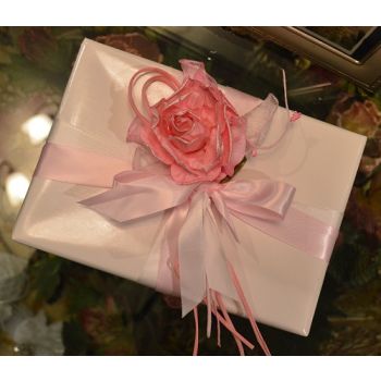 Gift wrapping with craft flower and confetti